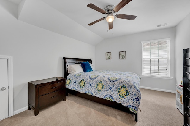 bedroom with light carpet, baseboards, visible vents, and vaulted ceiling