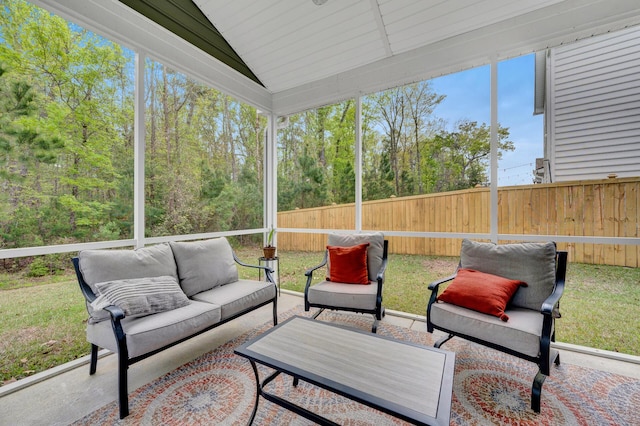 sunroom / solarium with lofted ceiling