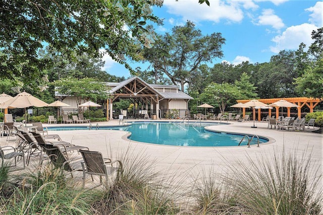 pool featuring a patio and fence