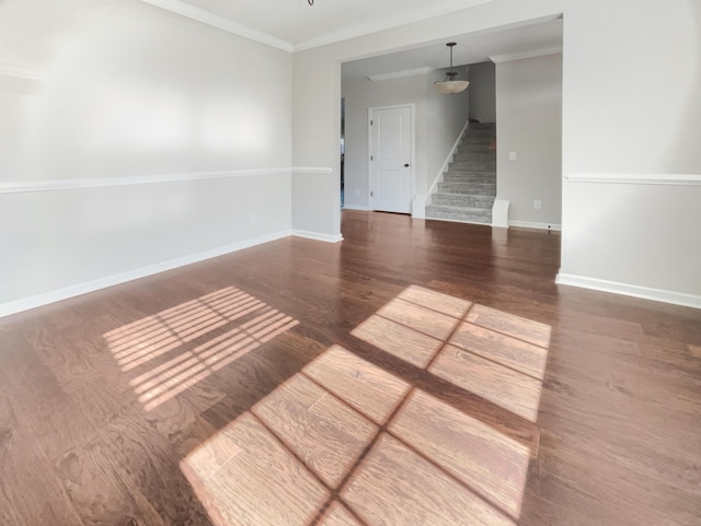 unfurnished room featuring dark hardwood / wood-style flooring and crown molding