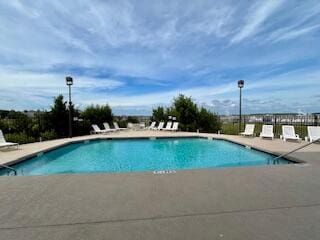 view of swimming pool featuring a patio