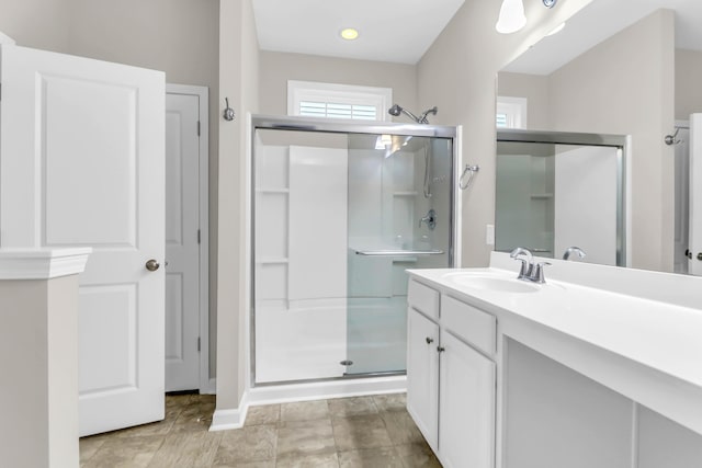 bathroom with vanity and walk in shower