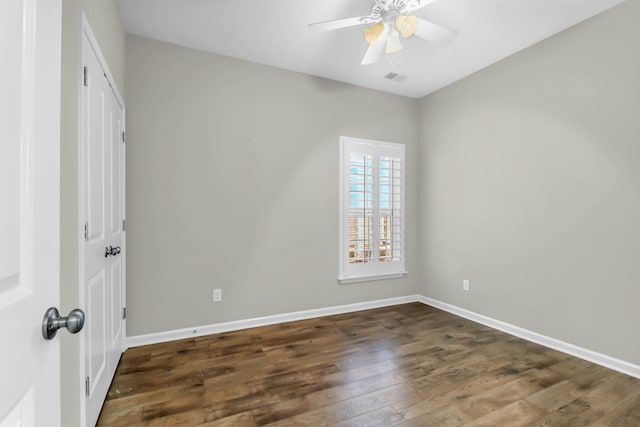 unfurnished bedroom featuring ceiling fan and dark hardwood / wood-style floors