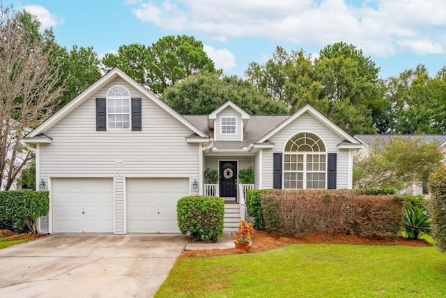 view of property with a front lawn and a garage