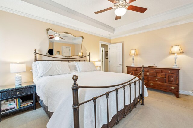 carpeted bedroom with ceiling fan and crown molding