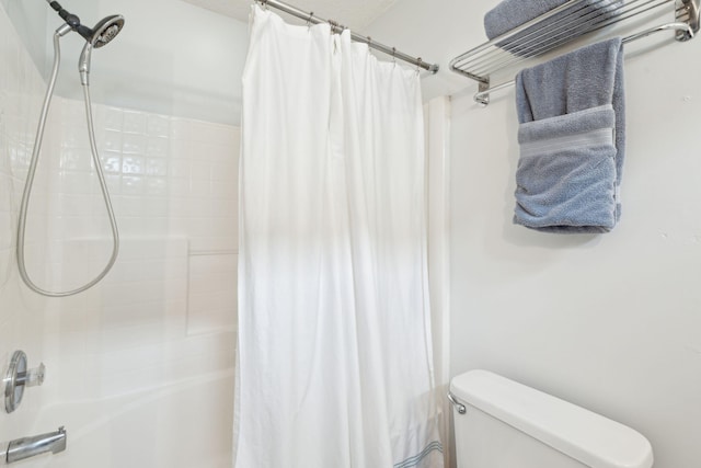 bathroom with toilet and shower / tub combo with curtain