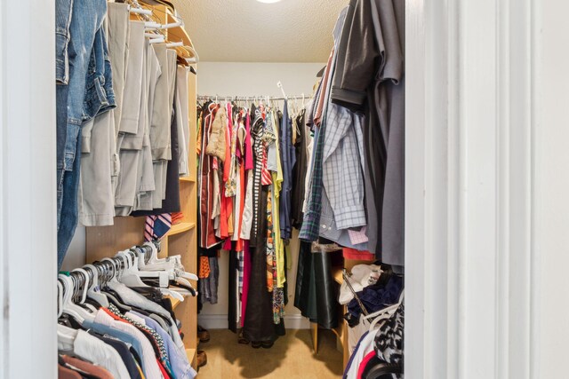 walk in closet featuring carpet