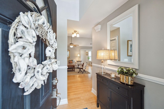 hall with light hardwood / wood-style floors