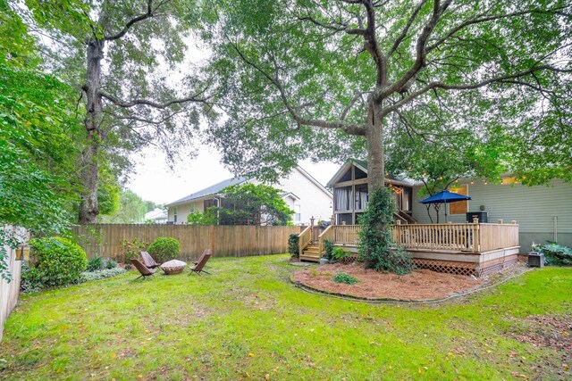 view of yard featuring a wooden deck