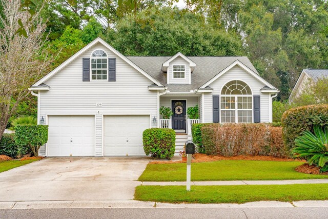 front of property featuring a front lawn and a garage