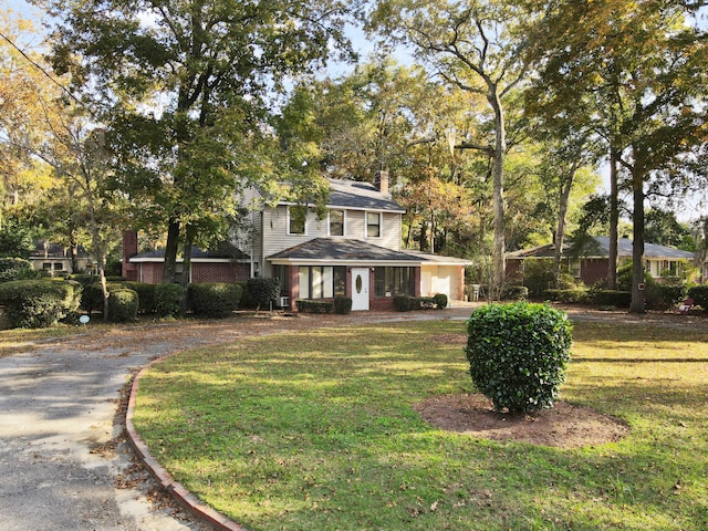 view of front of home with a front lawn