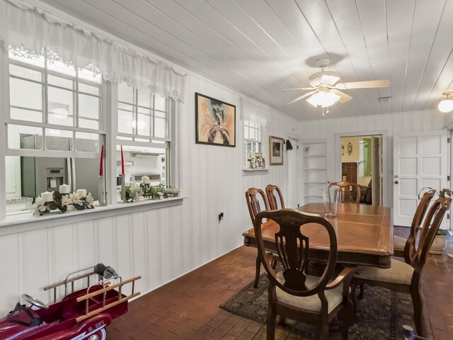 1104 2nd Ave, Kingstree, SC 29556 - dining room with brick floors, ceiling fan, wood ceiling, and ornamental molding