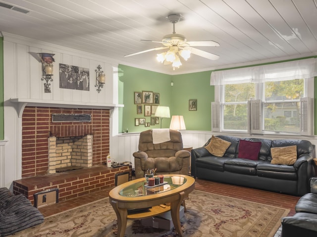 1104 2nd Ave, Kingstree, SC 29556 - living area featuring a brick fireplace, brick flooring, ceiling fan, a decorative wall, and crown molding