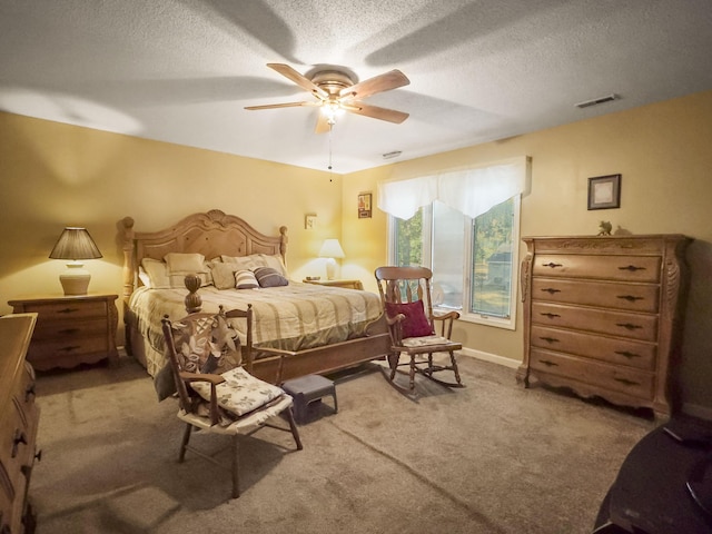 1104 2nd Ave, Kingstree, SC 29556 - bedroom with carpet floors, a textured ceiling, and ceiling fan