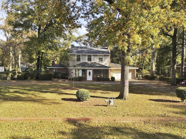 1104 2nd Ave, Kingstree, SC 29556 - back of property with an attached garage, a yard, and dirt driveway