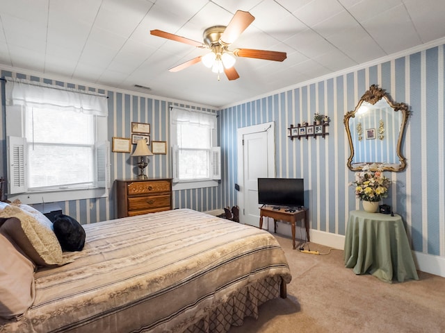 bedroom featuring ornamental molding, carpet, and ceiling fan