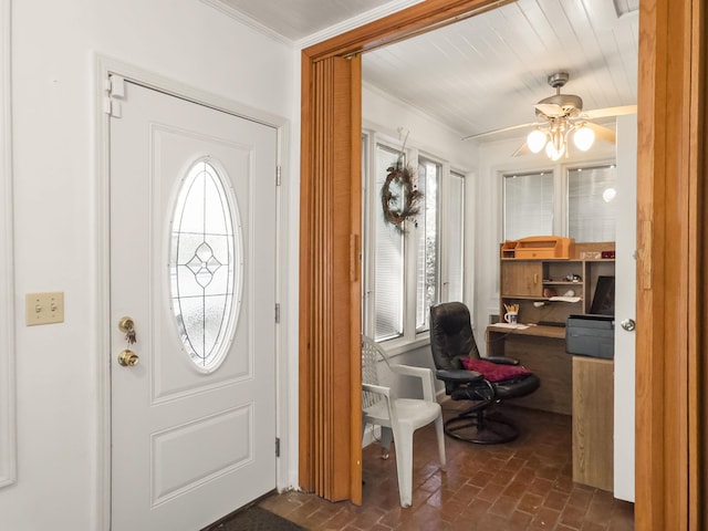 1104 2nd Ave, Kingstree, SC 29556 - foyer with brick flooring, ceiling fan, and crown molding