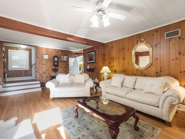 1104 2nd Ave, Kingstree, SC 29556 - living area featuring wood walls, ceiling fan, and light wood finished floors