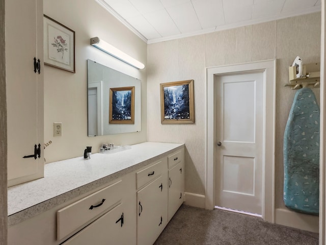 bathroom with vanity and ornamental molding