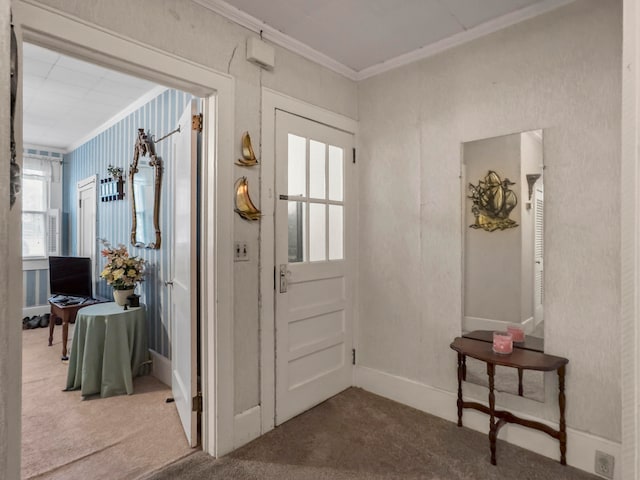 carpeted entryway with crown molding