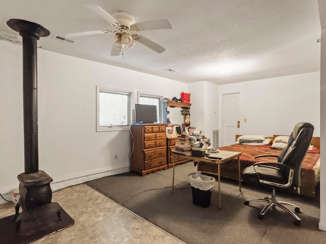 office with ceiling fan and a textured ceiling