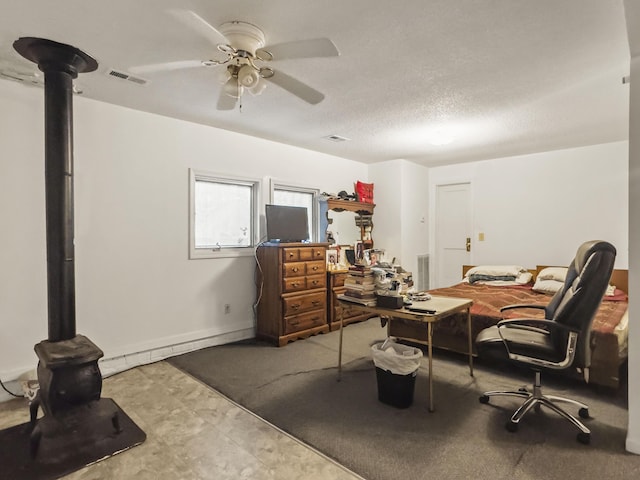 1104 2nd Ave, Kingstree, SC 29556 - office space with a ceiling fan, a wood stove, and a textured ceiling