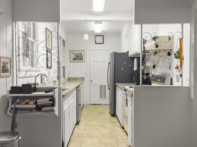 1104 2nd Ave, Kingstree, SC 29556 - kitchen with dishwasher, a sink, light stone counters, white cabinetry, and ornamental molding