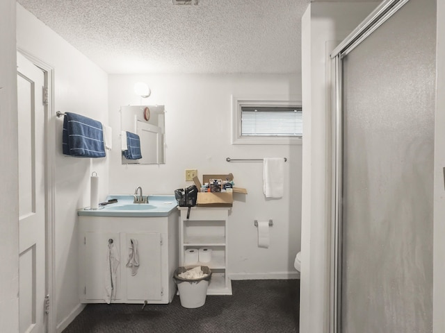 1104 2nd Ave, Kingstree, SC 29556 - full bathroom with toilet, a shower stall, vanity, a textured ceiling, and baseboards