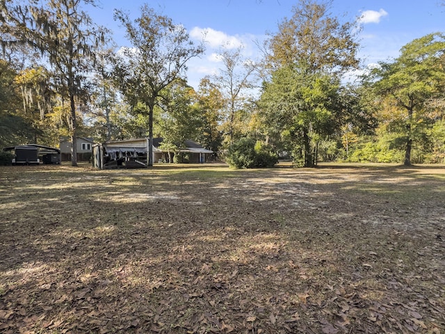 1104 2nd Ave, Kingstree, SC 29556 - view of yard with a carport