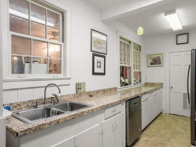 kitchen with dishwasher, hanging light fixtures, sink, crown molding, and white cabinetry