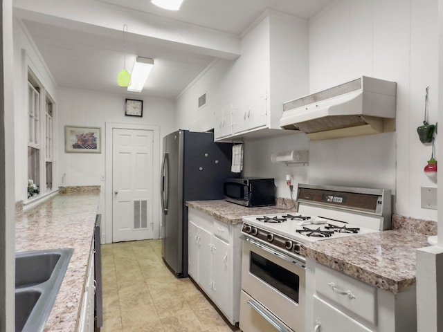 kitchen with white cabinets, white gas range, range hood, and decorative light fixtures