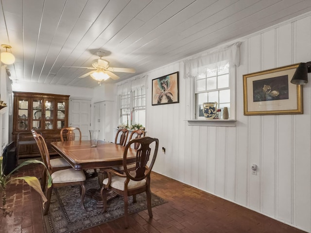 1104 2nd Ave, Kingstree, SC 29556 - dining area with healthy amount of natural light, brick floors, a ceiling fan, and wood ceiling