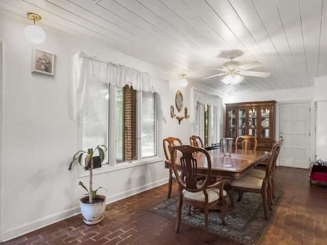 1104 2nd Ave, Kingstree, SC 29556 - dining area with wooden ceiling, healthy amount of natural light, baseboards, a ceiling fan, and brick patterned flooring