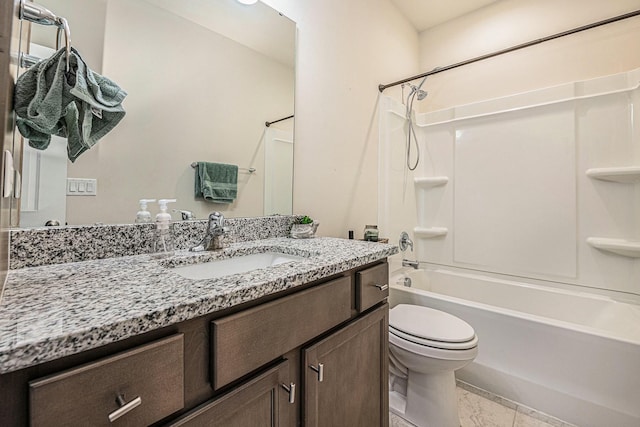 bathroom featuring toilet, tub / shower combination, and vanity