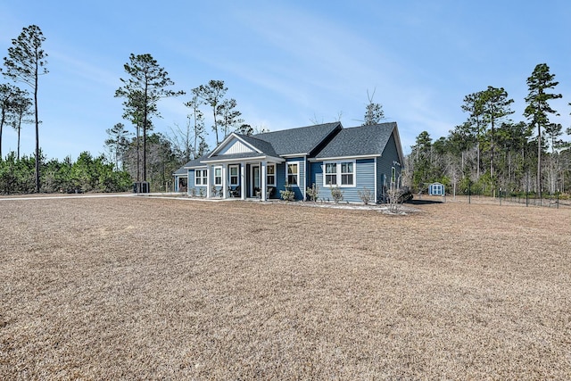 view of front of house featuring roof with shingles