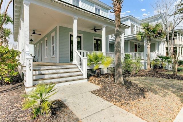 doorway to property with covered porch and ceiling fan