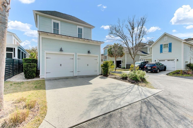 view of front of home with an attached garage and concrete driveway