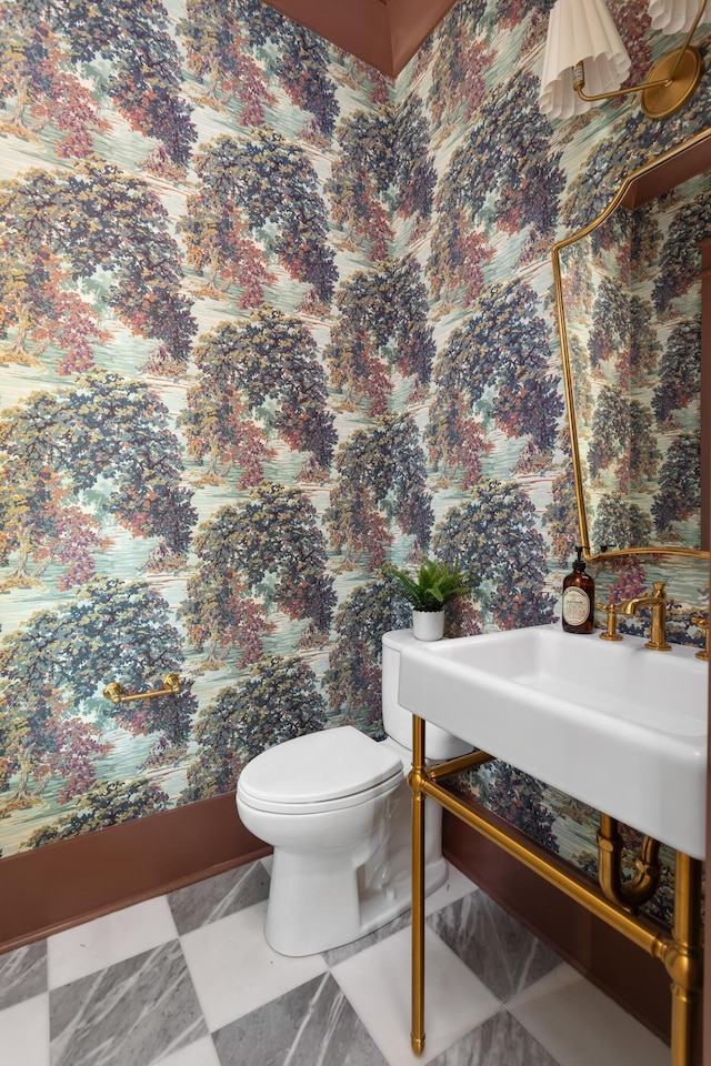 bathroom featuring sink and toilet