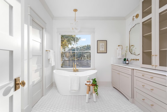 bathroom featuring vanity and a washtub