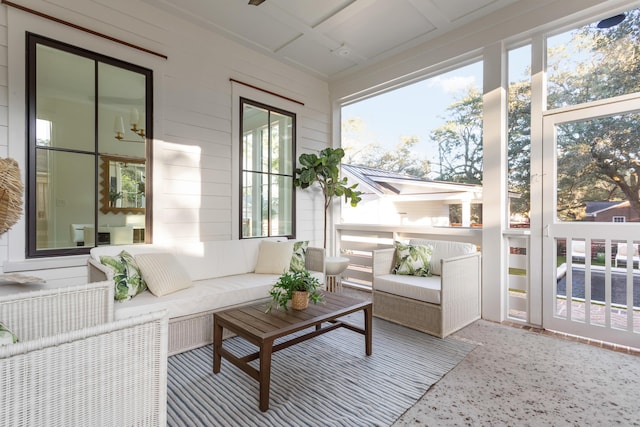 sunroom featuring coffered ceiling