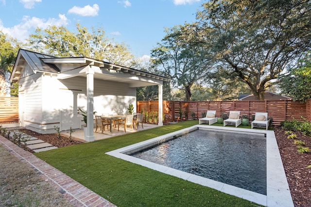 exterior space with a fenced in pool, a yard, and a patio