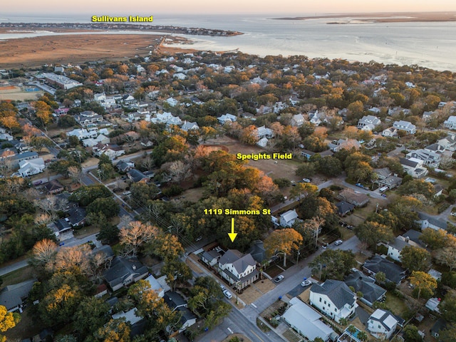 aerial view at dusk with a water view