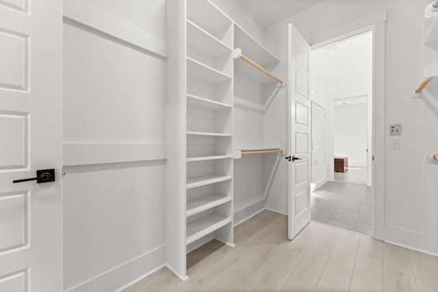 spacious closet with wood finished floors