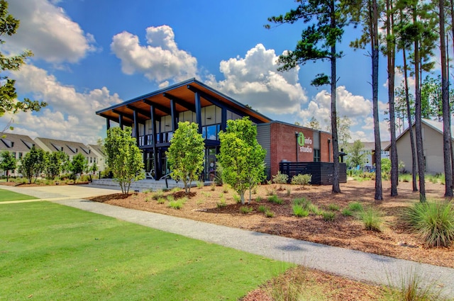 exterior space with driveway and a yard