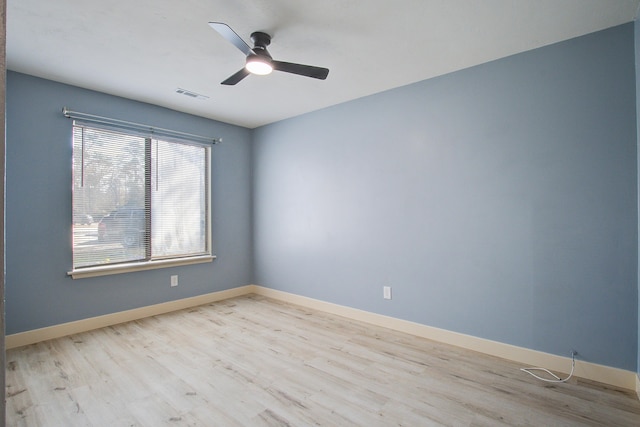 spare room featuring ceiling fan and light hardwood / wood-style floors