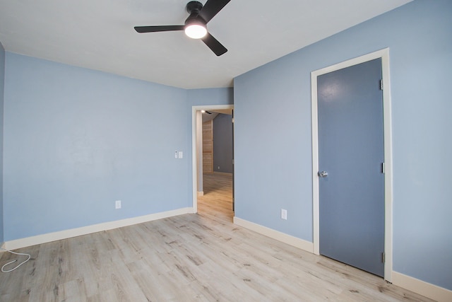 unfurnished bedroom with ceiling fan and light wood-type flooring