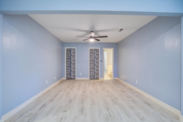 empty room with ceiling fan and light wood-type flooring