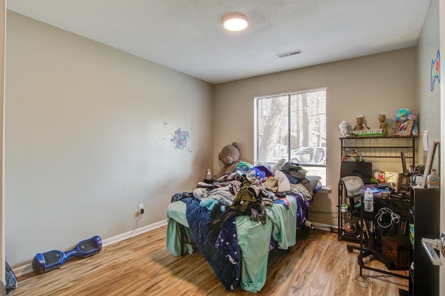 bedroom featuring hardwood / wood-style flooring