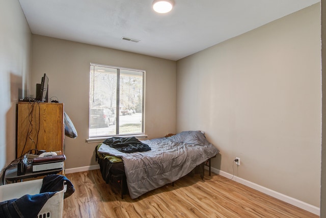 bedroom with light hardwood / wood-style flooring