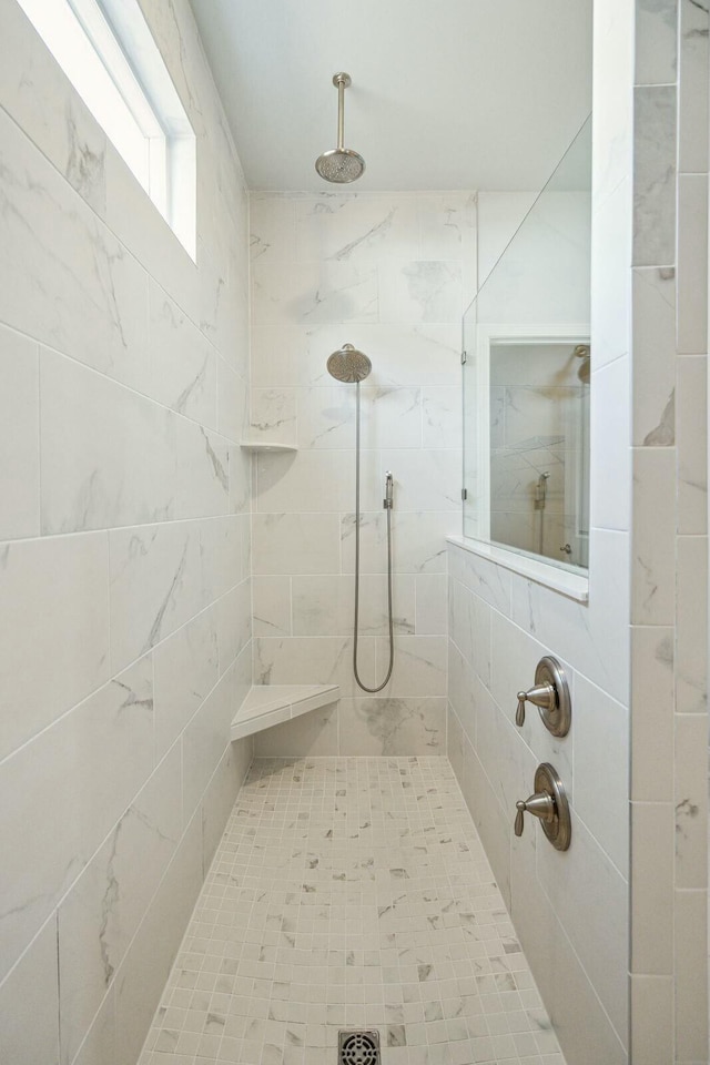 full bathroom with tiled shower